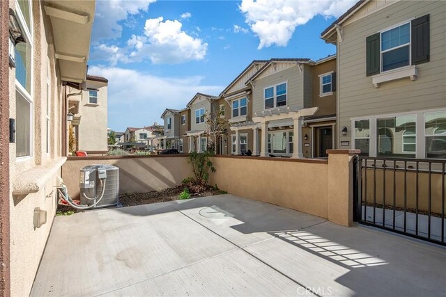 16022 Voyager Ave, Chino, CA 91708 - view of patio featuring a residential view, central AC unit, and a pergola