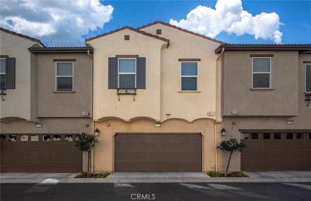 16022 Voyager Ave, Chino, CA 91708 - mediterranean / spanish home featuring stucco siding, an attached garage, and a tiled roof