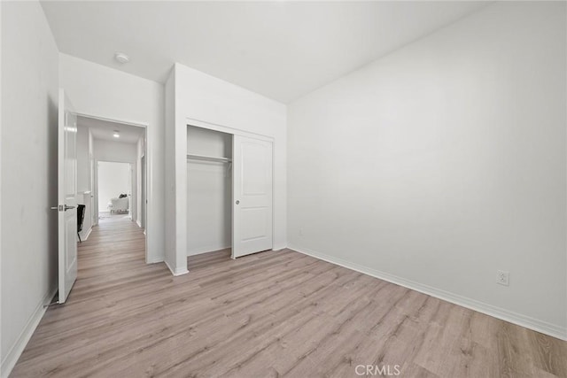 16022 Voyager Ave, Chino, CA 91708 - unfurnished bedroom featuring light wood-style flooring, baseboards, and a closet