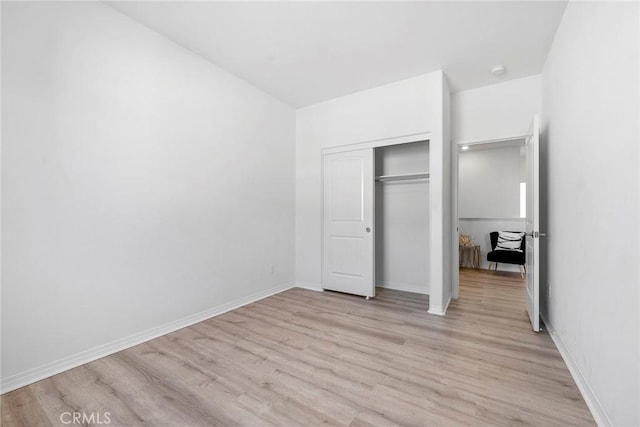 16022 Voyager Ave, Chino, CA 91708 - unfurnished bedroom with light wood-style floors, a closet, and baseboards