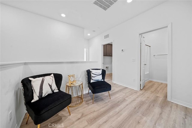 16022 Voyager Ave, Chino, CA 91708 - sitting room with wood finished floors, recessed lighting, and baseboards