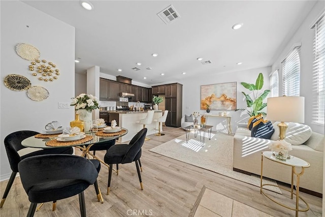 16022 Voyager Ave, Chino, CA 91708 - dining area with light wood-type flooring, recessed lighting, and baseboards