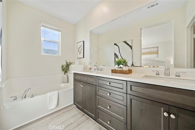 16022 Voyager Ave, Chino, CA 91708 - full bath with wood finished floors, a bath, and double vanity