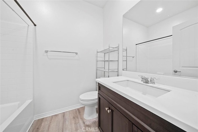 16022 Voyager Ave, Chino, CA 91708 - full bath featuring wood finished floors, toilet, baseboards, vanity, and tub / shower combination