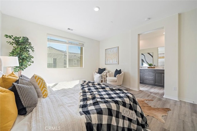 16022 Voyager Ave, Chino, CA 91708 - bedroom featuring light wood-style floors, baseboards, and ensuite bathroom