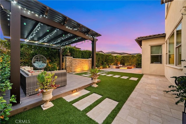 107 Balance, Irvine, CA 92618 - yard at dusk featuring an outdoor living space, a pergola, a patio area, and a fenced backyard