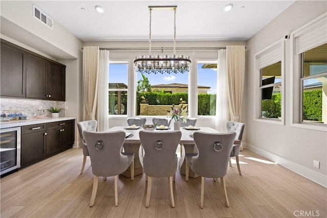 107 Balance, Irvine, CA 92618 - dining space with wine cooler, healthy amount of natural light, light wood-type flooring, and recessed lighting