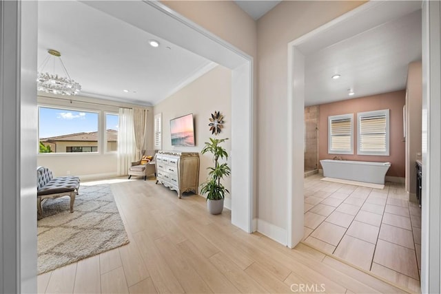 107 Balance, Irvine, CA 92618 - hallway featuring light wood-style flooring, recessed lighting, and a chandelier