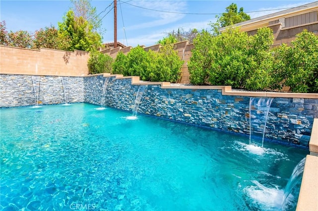 view of swimming pool with a fenced in pool and a fenced backyard