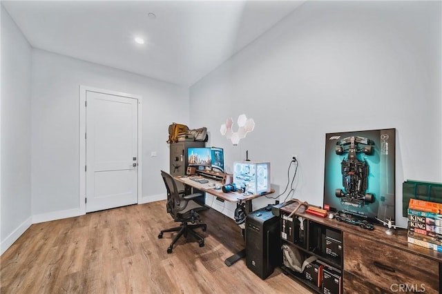 office area featuring light wood-style flooring and baseboards