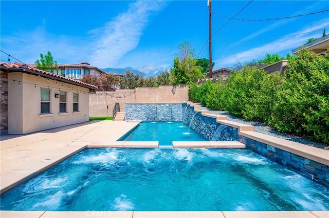view of swimming pool with a fenced backyard, a fenced in pool, and a patio area