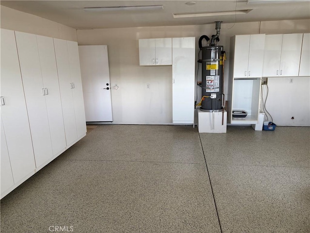 garage with strapped water heater