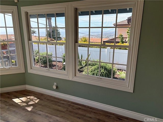 details with wood finished floors and baseboards