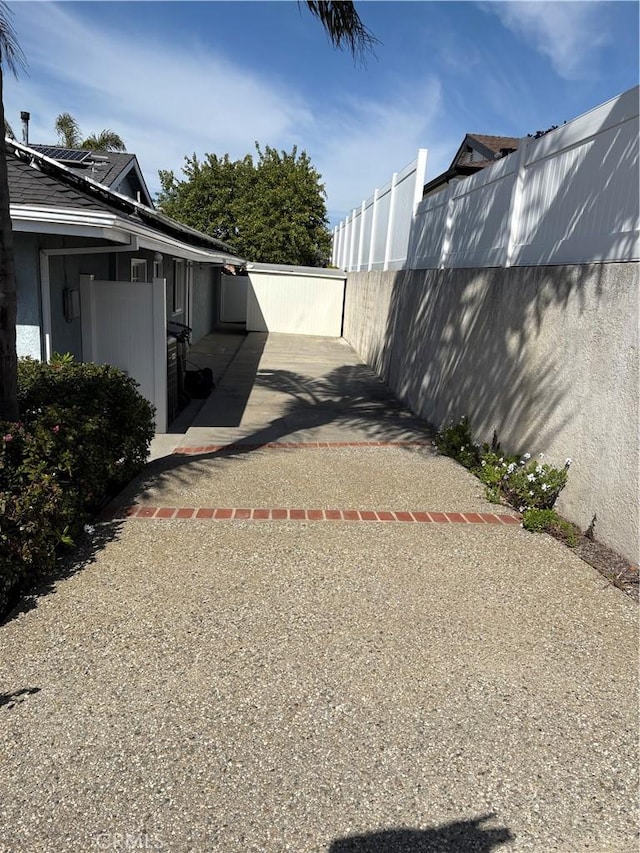 view of yard featuring a patio and fence
