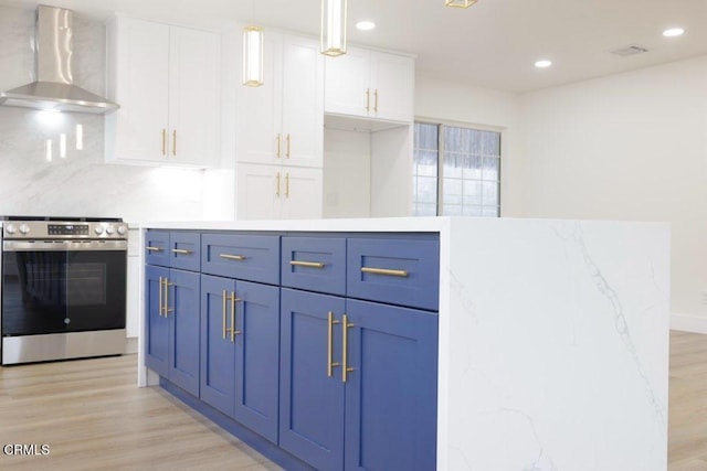 kitchen featuring stainless steel range with electric cooktop, wall chimney exhaust hood, white cabinets, and light wood-type flooring