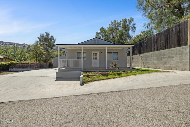 6015 Peppertree Ln, Simi Valley, CA 93063 - view of front of property featuring covered porch, concrete driveway, and stucco siding