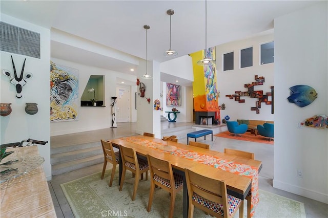 dining space featuring recessed lighting and baseboards