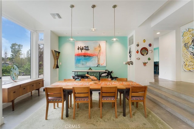 dining area with concrete flooring and visible vents