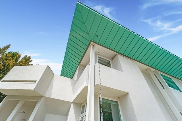 view of side of property with stucco siding