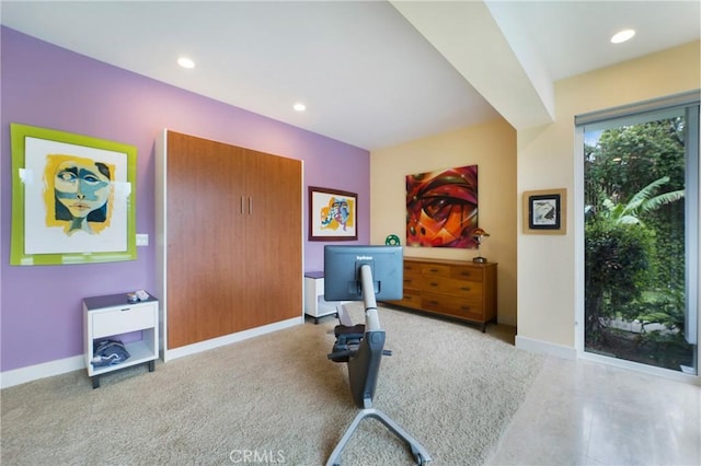 exercise room with baseboards and recessed lighting