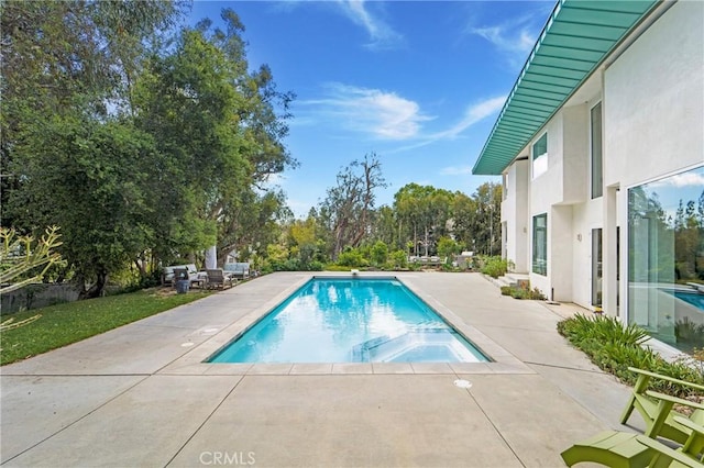 pool featuring a patio area