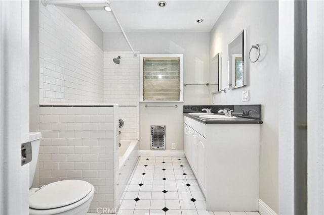 full bath with tile patterned flooring, shower / bathtub combination, vanity, and toilet