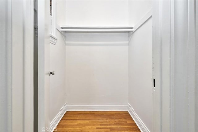 spacious closet with wood finished floors