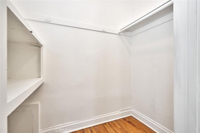 spacious closet with wood finished floors