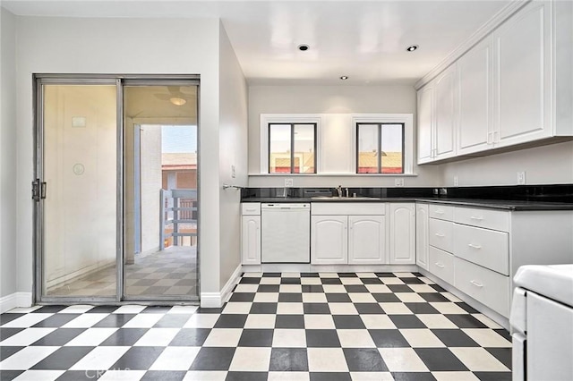 kitchen with white cabinets, a healthy amount of sunlight, white dishwasher, and light floors