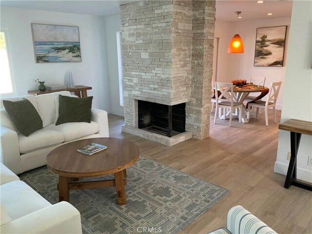 33922 Manta Ct, Dana Point, CA 92629 - living area featuring a fireplace, wood finished floors, and recessed lighting