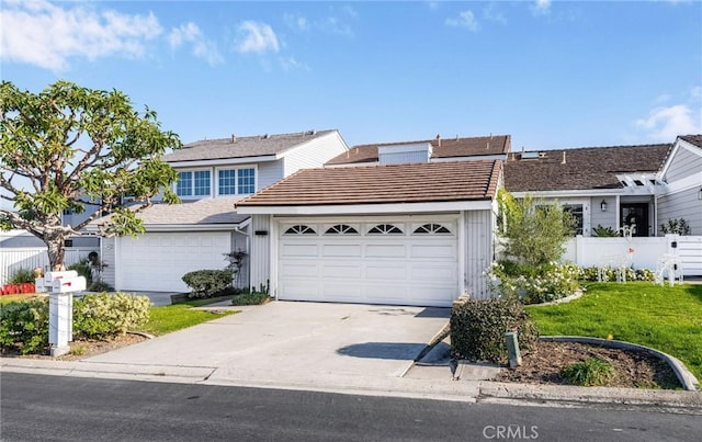 33922 Manta Ct, Dana Point, CA 92629 - view of front of house with a garage, driveway, and fence