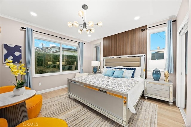 bedroom with light wood-type flooring, an inviting chandelier, baseboards, ornamental molding, and recessed lighting