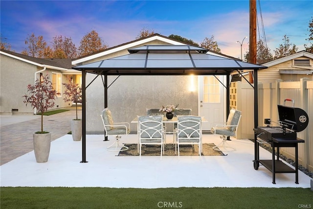 view of patio / terrace with a gazebo and fence
