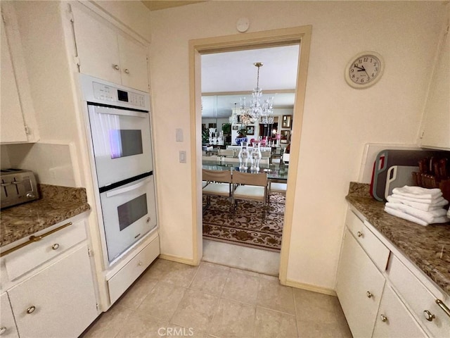 2117 Glenn St, Los Osos, CA 93402 - kitchen featuring white double oven, a chandelier, baseboards, and light tile patterned floors