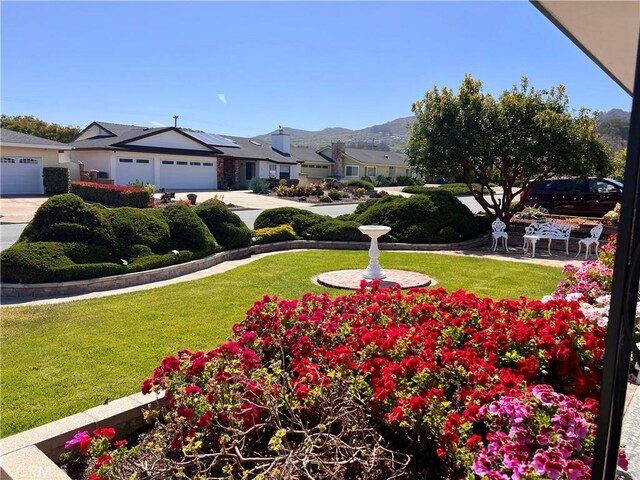 2117 Glenn St, Los Osos, CA 93402 - view of yard with concrete driveway, a residential view, a garage, and a mountain view