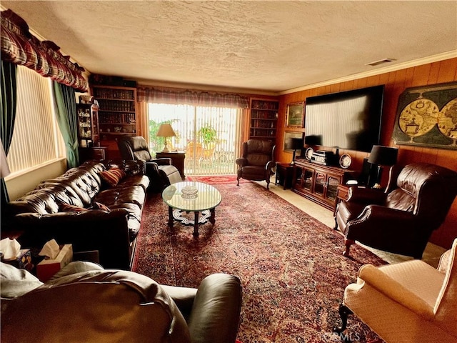 2117 Glenn St, Los Osos, CA 93402 - living area featuring carpet flooring, a textured ceiling, visible vents, and wooden walls
