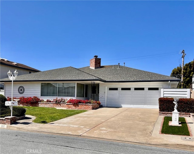 2117 Glenn St, Los Osos, CA 93402 - ranch-style house featuring a chimney, a garage, concrete driveway, roof with shingles, and a front lawn