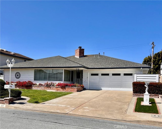 2117 Glenn St, Los Osos, CA 93402 - ranch-style house with an attached garage, concrete driveway, a chimney, a front yard, and a shingled roof