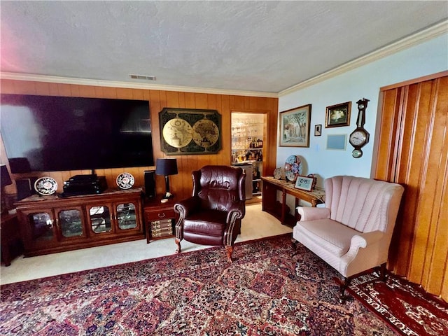 2117 Glenn St, Los Osos, CA 93402 - carpeted living area with ornamental molding, visible vents, and wood walls