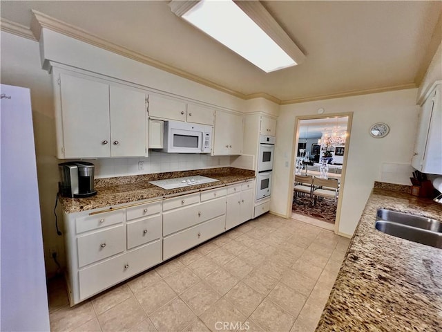 2117 Glenn St, Los Osos, CA 93402 - kitchen with white appliances, ornamental molding, and white cabinets