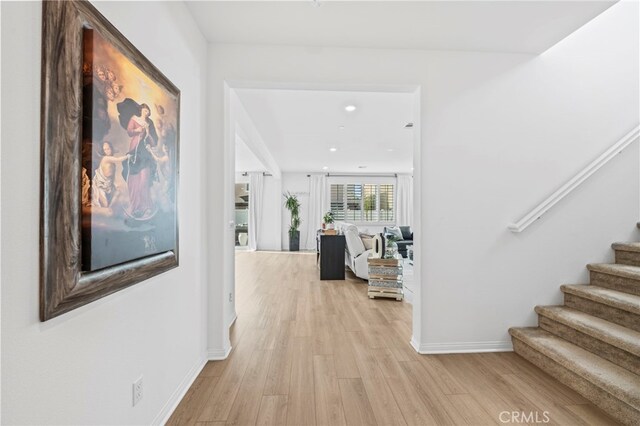 5053 Moon Eye Way, Hemet, CA 92545 - corridor with light wood-style flooring, baseboards, stairs, and recessed lighting