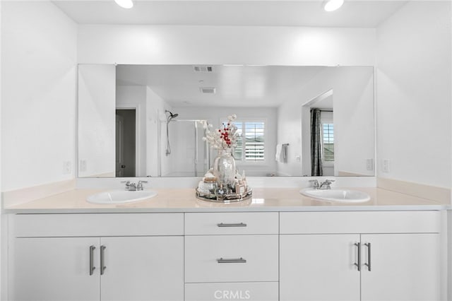 5053 Moon Eye Way, Hemet, CA 92545 - full bathroom with visible vents, a sink, and a stall shower