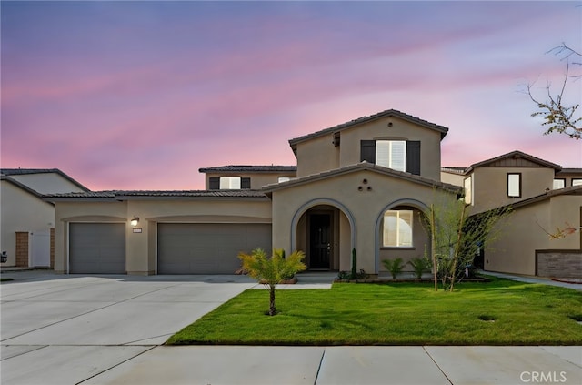 5053 Moon Eye Way, Hemet, CA 92545 - mediterranean / spanish home featuring stucco siding, an attached garage, concrete driveway, and a yard