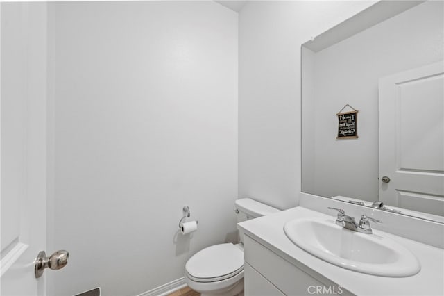 5053 Moon Eye Way, Hemet, CA 92545 - half bathroom featuring toilet, vanity, and baseboards