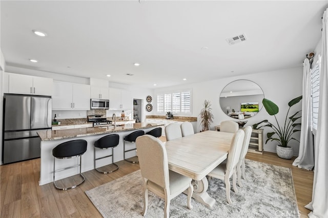 5053 Moon Eye Way, Hemet, CA 92545 - dining space featuring visible vents, recessed lighting, and light wood finished floors