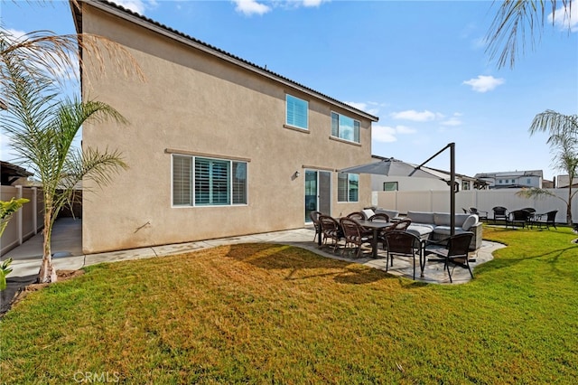 5053 Moon Eye Way, Hemet, CA 92545 - rear view of house featuring a fenced backyard, a lawn, stucco siding, and a patio