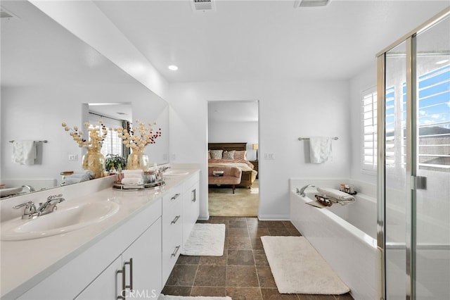 5053 Moon Eye Way, Hemet, CA 92545 - ensuite bathroom featuring ensuite bath, a wealth of natural light, a sink, and double vanity