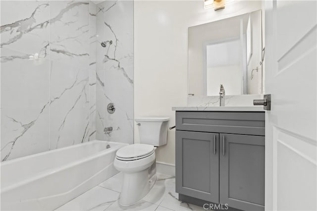 bathroom with marble finish floor, tub / shower combination, toilet, and vanity