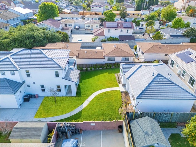 birds eye view of property with a residential view