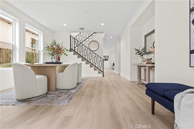 foyer entrance featuring recessed lighting, stairs, and wood finished floors